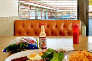 Mexican rice, Salad and Hot Sauce TAPATIO at Fast Food Restaurant