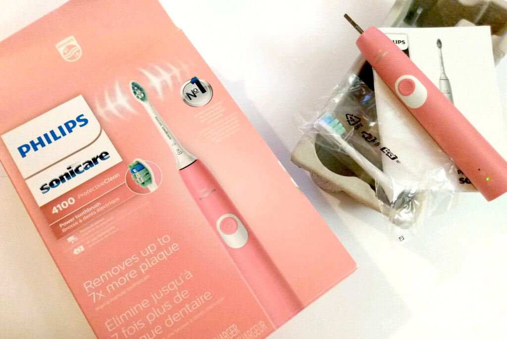 An Electric Toothbrush Philips Sonicare Pink color