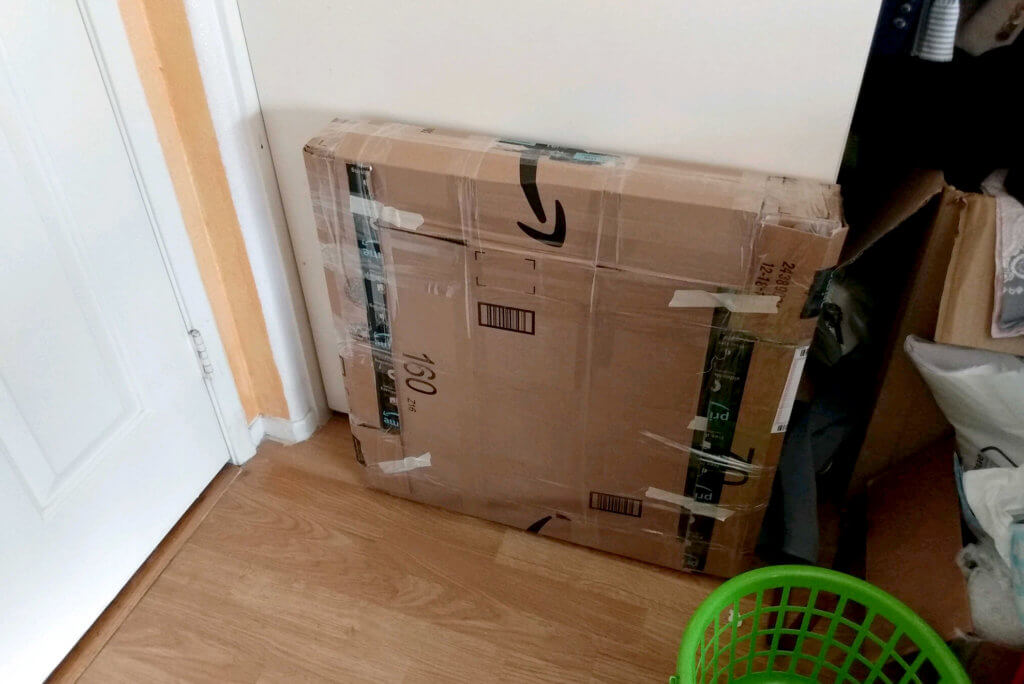 Packed paintings with amazon's cardboard for shipping