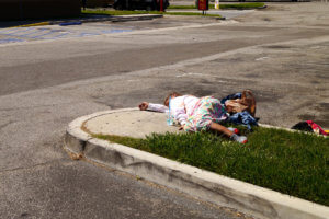 Sleeping Homeless woman at the car park in Torrance