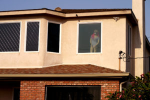 a woman mannequin stand on front of the window in LA