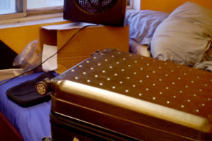 A suit case on the bed in American house