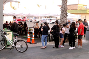 Customers queue for Korean BBQ restaurant