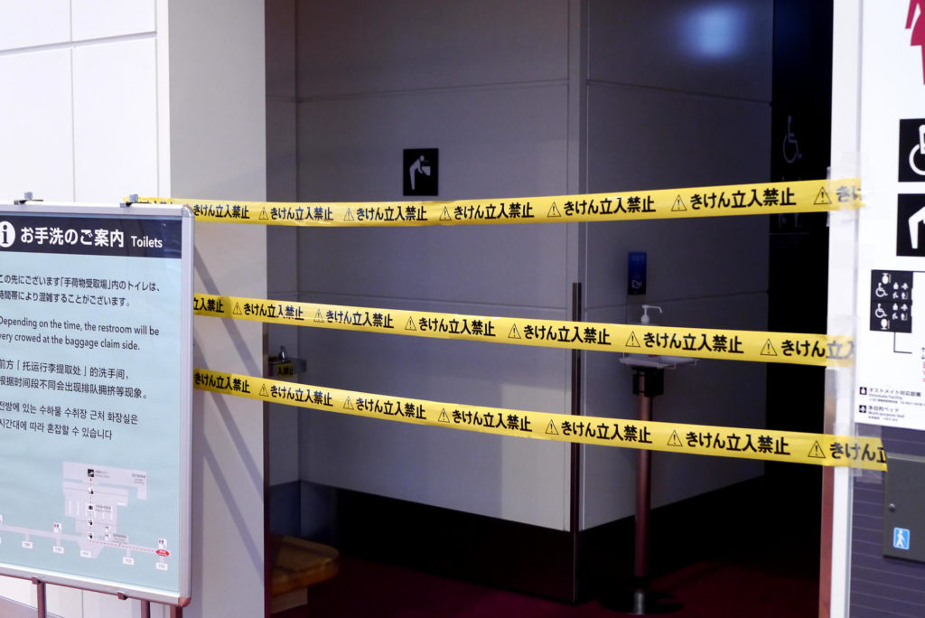 Crime tape at the Haneda airport front of the rest room