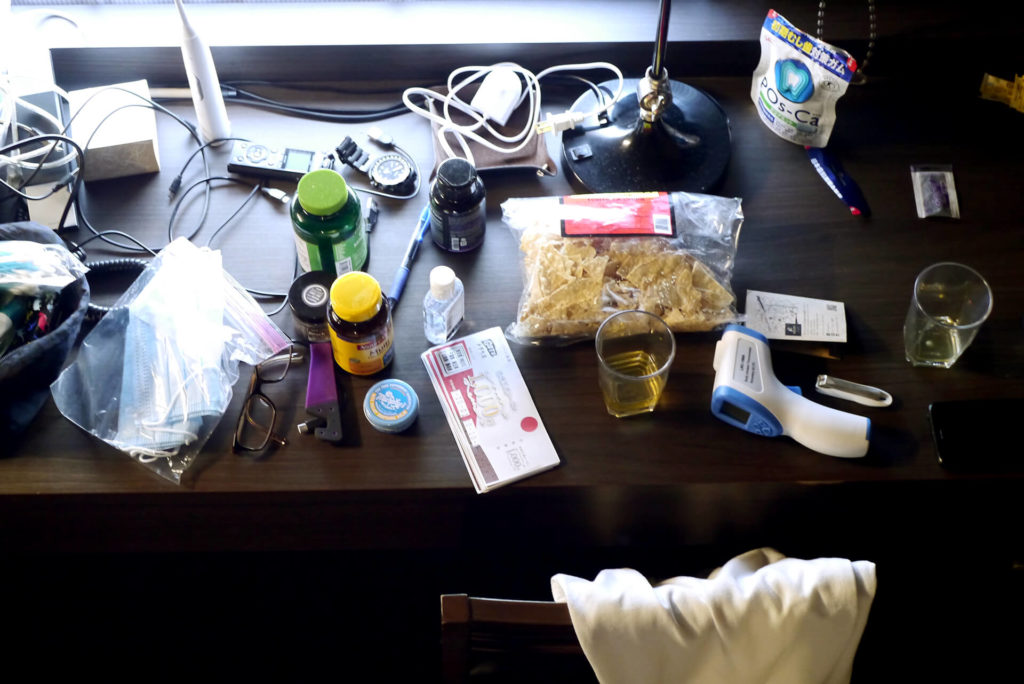 Messy desk at the hotel in Japan for quarantine time under effects of the covid-19