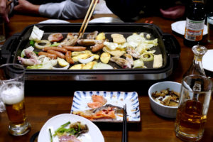 Familiy BBQ on the hot plate, beer