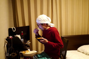 Man eating bento at the hotel room in Kusatsu