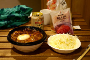 Pork bowl and a salad on the wooden table