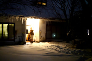 white house with much snow at the night