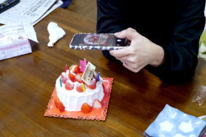 Taking photo a Japanese birthday cake