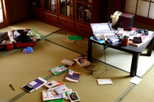 Messy books on tatami mat floor