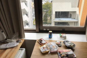 many dishes and drink on the window side at the hotel in Hiroshima Japan