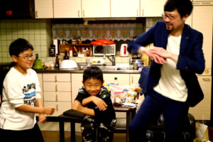 Three Dancing man and kids Gangnam style at Japanese dining room