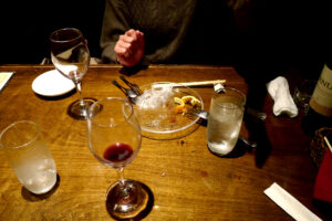 Wine glasses and dishes on the table at restaurant Hiroshima Japan