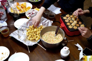 Cooking takoyaki and snacks on the table in Hiroshima Japan