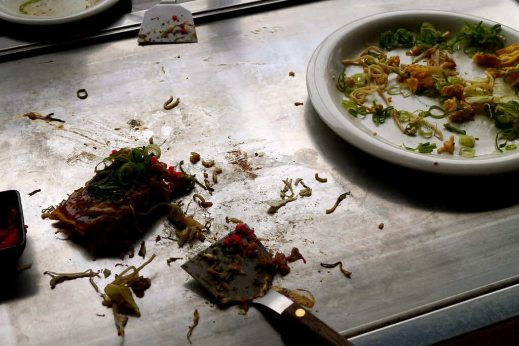 leftover hiroshima okonomiyaki on the food grilled on an iron plate