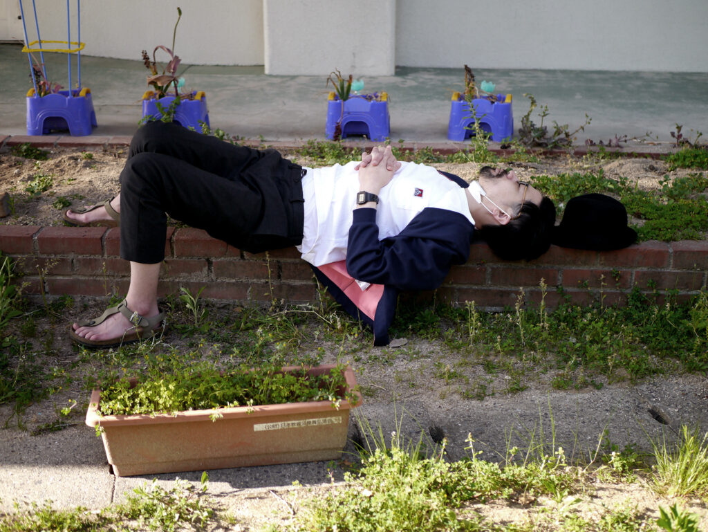 Image of a man lying down in elementary school