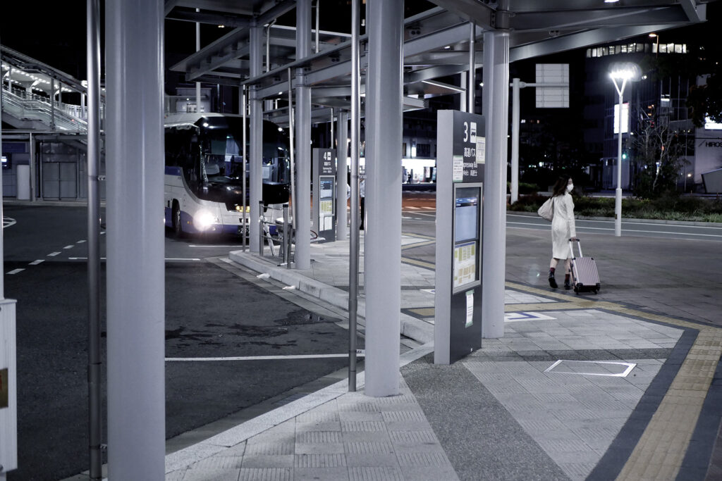 An woman is going to take an express bus at the bus station in Hiroshima Japan