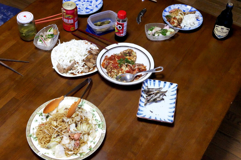 Fried noodles, Natto omllet, and dried sardines etc on the table in Hiroshima Japan
