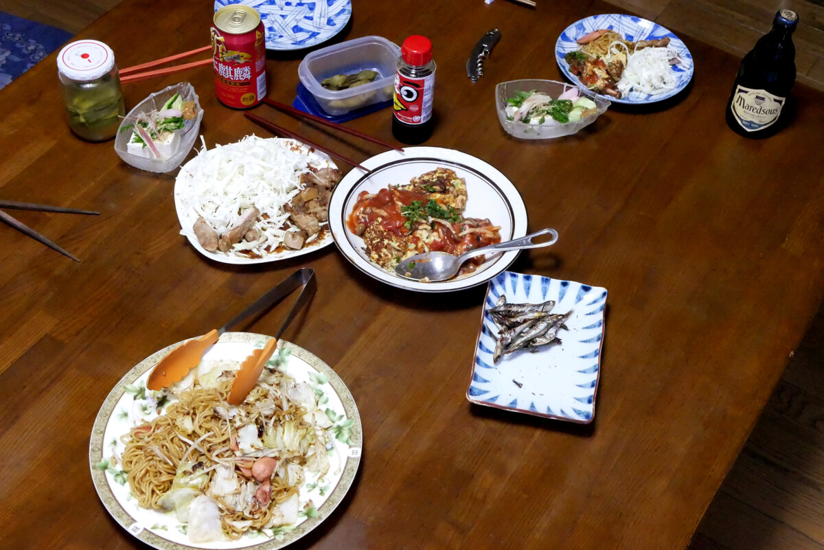 Fried noodles etc Fried noodles, Natto omllet, and dried sardines etc on the table in Hiroshima Japan