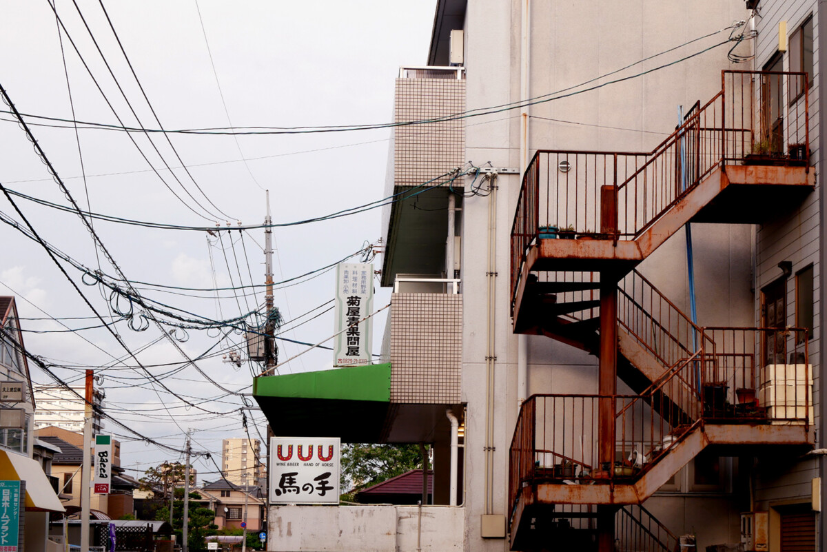 Small street corner Electrical wire and an old iron stairs in a small town in Hiroshima Japan