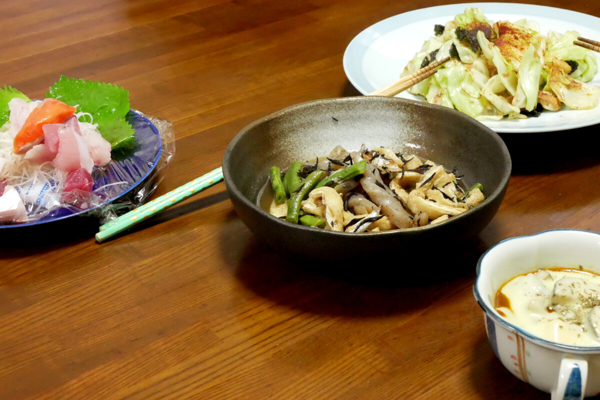 Sashimi and Nimono Sashimi, Nimono, fried cabbage with tuna and cheesy curry soup on the table