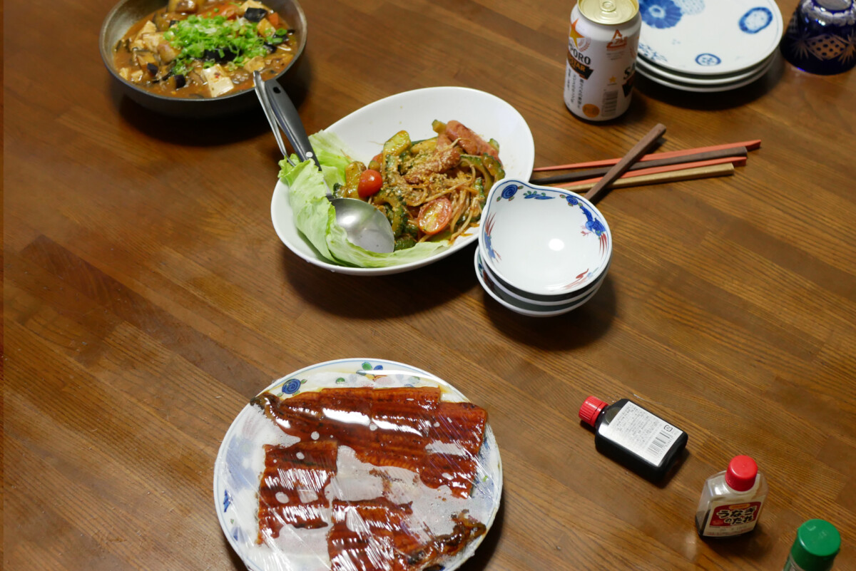 Japanese dinner Mapo eggplant, stirred goya and grilled unagi on the table in Hiroshima Japan