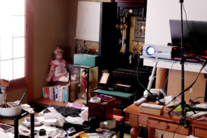 a doll, projector, laptop etc. quite messy Japanese washitsu tatami mat room in Hiroshima Japan