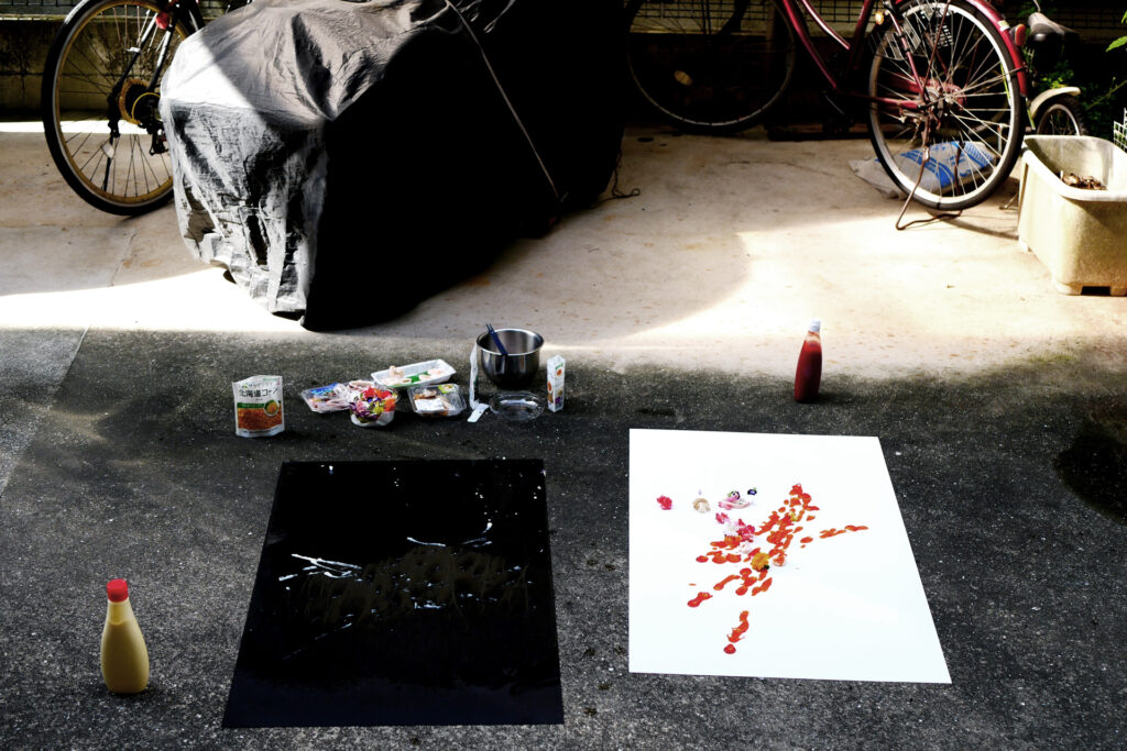 Creating artwork by mayonnaise and ketchup on the yard in Hiroshima Japan