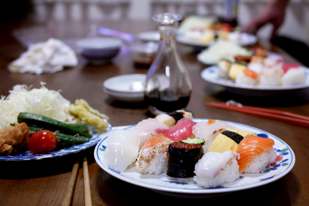 10 variety of Sushi and salad plate on the table at Japanese family's house