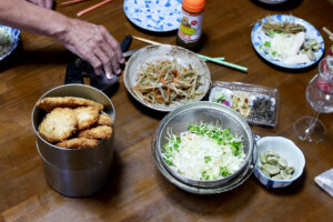 Deep fried Mackerel, shredded cabbage and kinpira on the wooden table