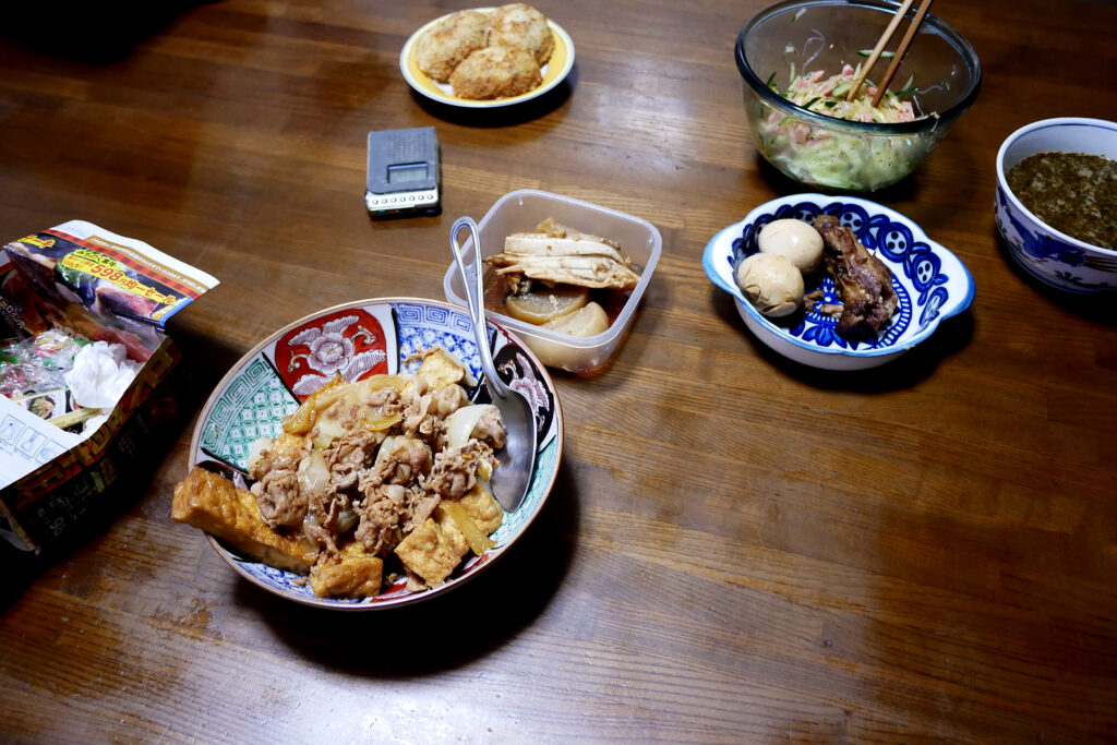 Japanese nimono, simmered pork rib and dishes on the wooden table in Hiroshima Japan