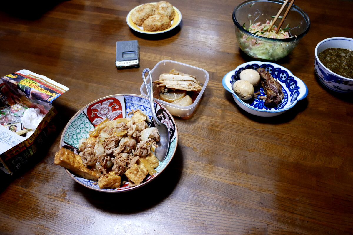 Japanese nimono Japanese nimono, simmered pork rib and dishes on the wooden table in Hiroshima Japan