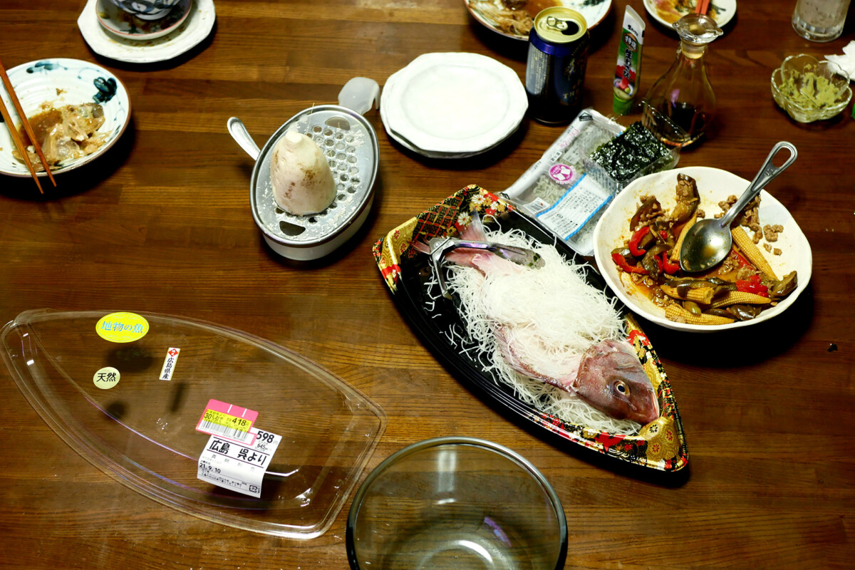 Dinner table Japanese dishes on the table like sea bream sashimi which was super discounted