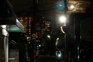 Full moon in the sky above the dark road in Hiroshima Japan