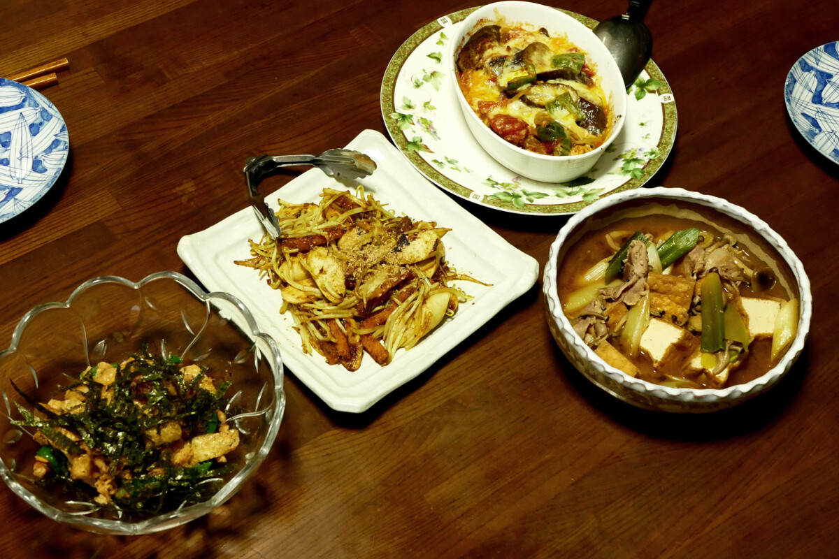 Home made Japanese dishes Four plate of the home made Japanese dishes on the wooden table