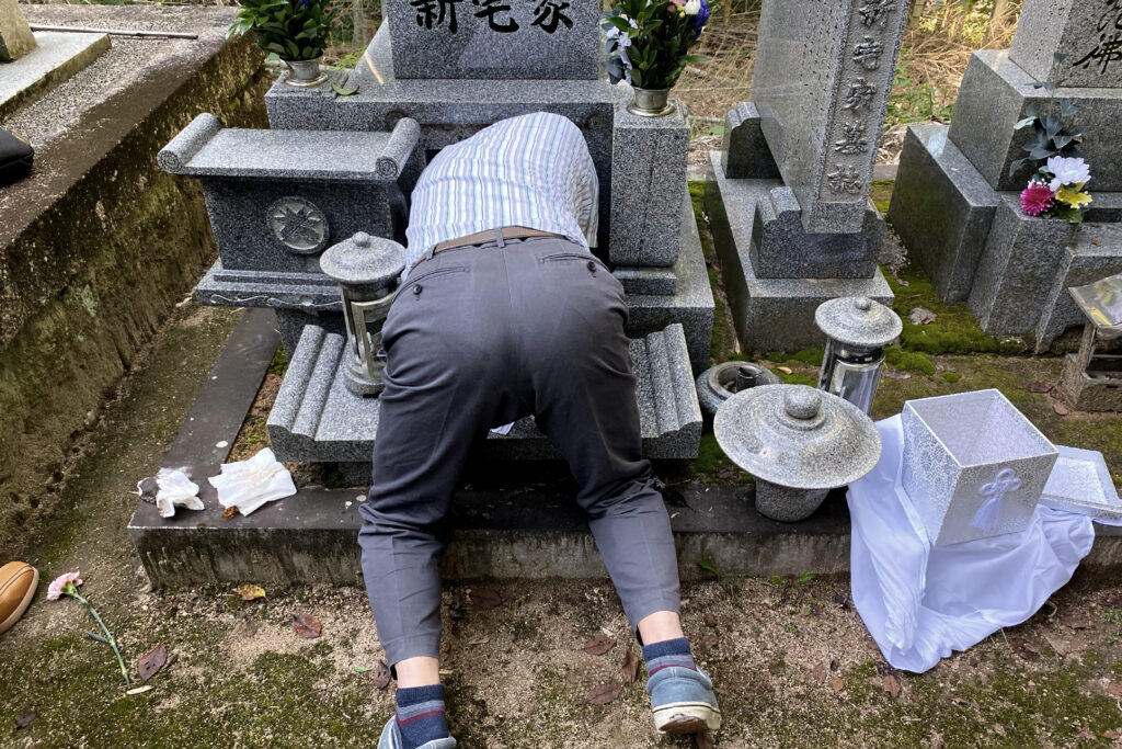 An old Japanese man is going to into an ancient tomb