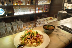 Thai chicken dishes on the bar counter