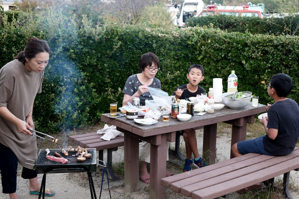 A family are having BBQ at outside in Hiroshima Kamagari island Japan