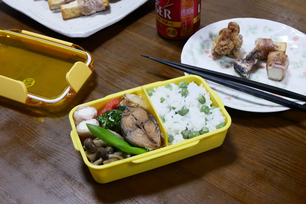 Home made Bento and plates on the wooden table