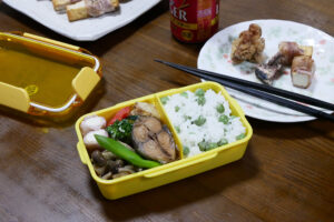 Home made Bento and plates on the wooden table