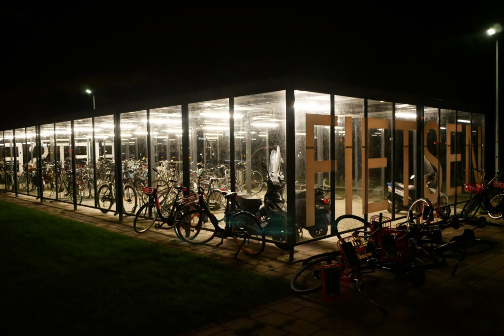 Bright bicycles parking space in the dark in the Netherlands