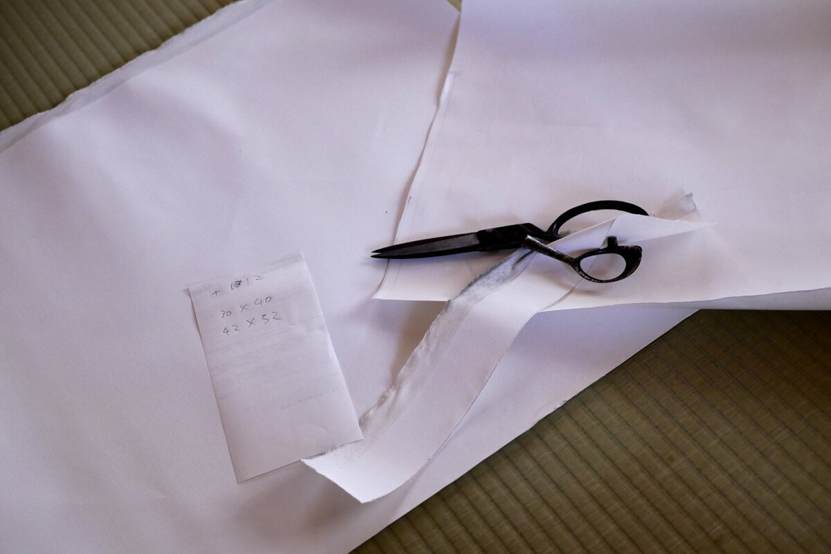Cut canvas Scissors is cutting canvas