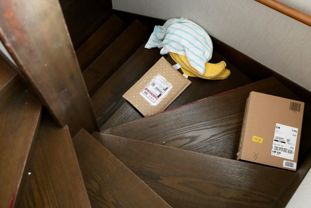 Amazon packages and towel on the stairs