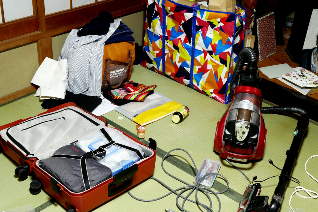 Luggages, vacuum cleaner etc., on the tatami mat floor