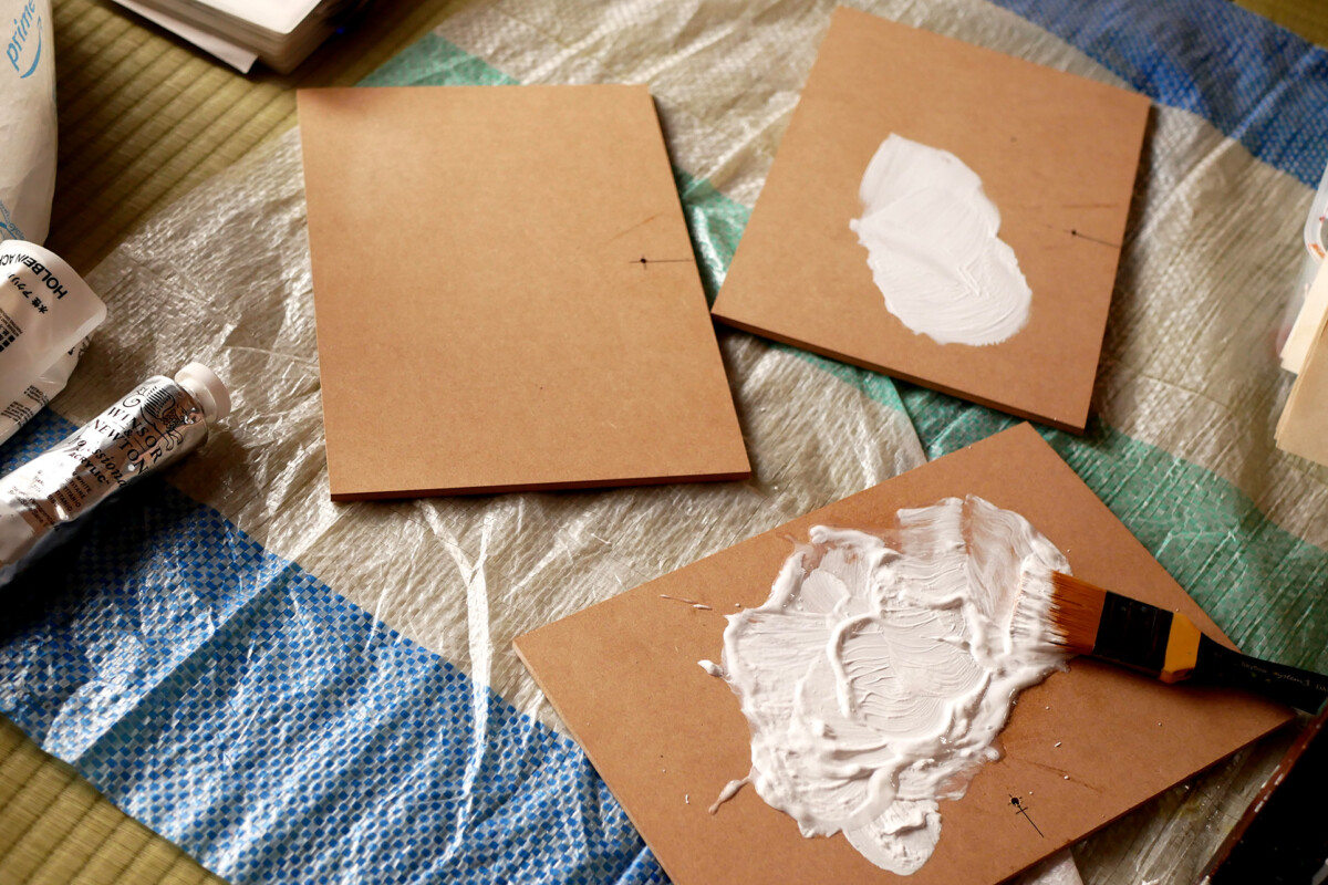 Painted MDF boards Painted white three MDF boards on the plastic sheet