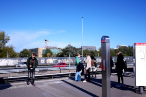 People at the station and blue sky in the Netherlands