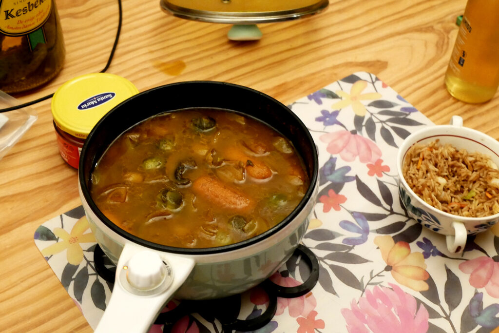 Curry hot pot and fried rice of the cup on the wooden table