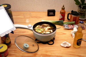 iPad, seasonings, and Personal hot pot on the wooden table