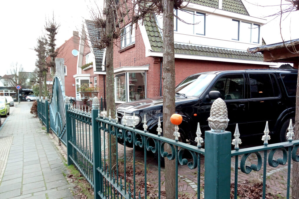 Orange on the fence in the street in the Netherlands